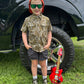 Boy wearing Mossy Oak® Bottomland short sleeve shirt by Buck Brothers® - outdoor kids clothing for hunting and southern family lifestyle.